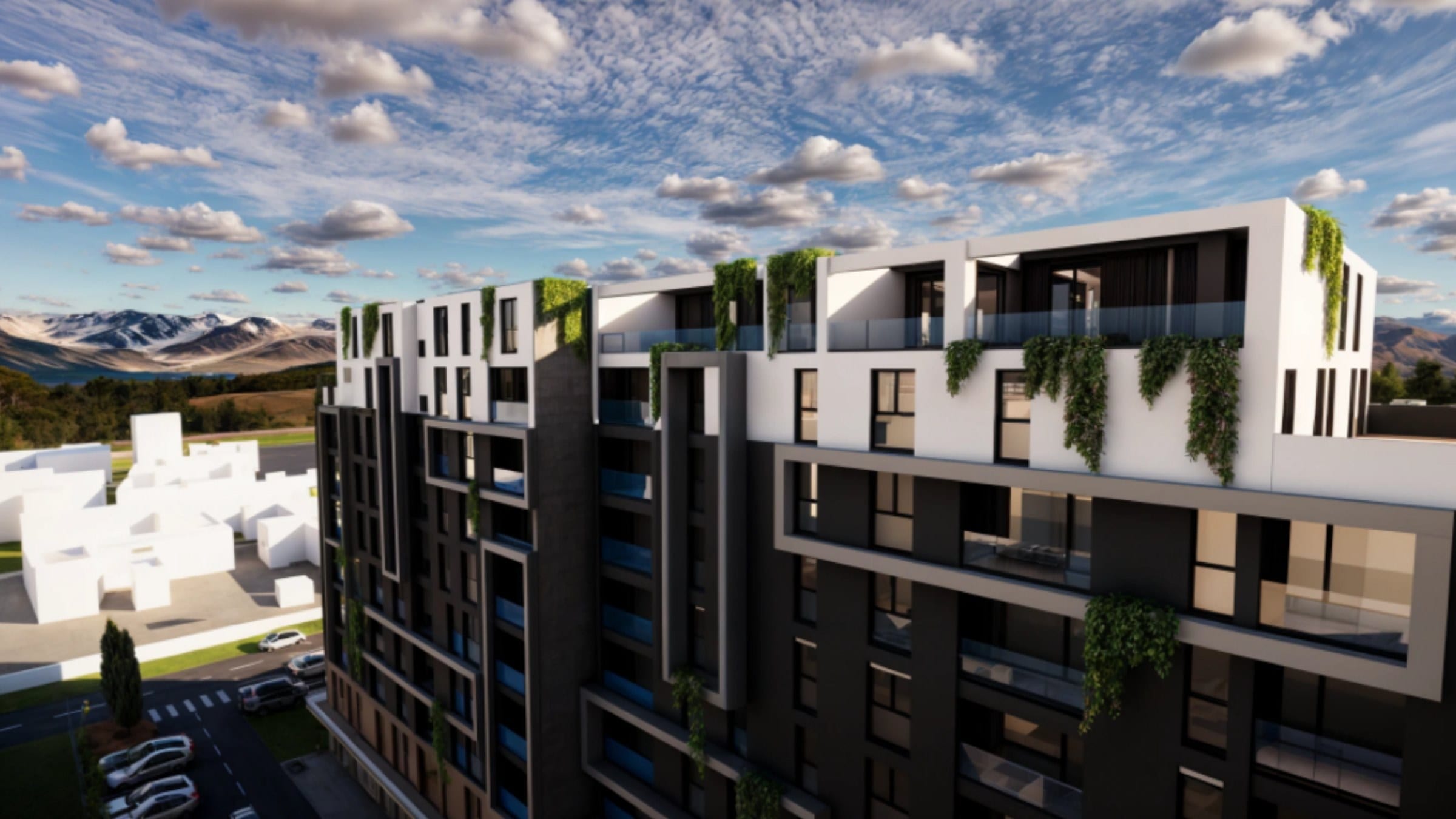 Elysium Series 1: a multi-storey residential building with dark brick and pale render, planted balconies and mountains beyond, rendered at dusk.