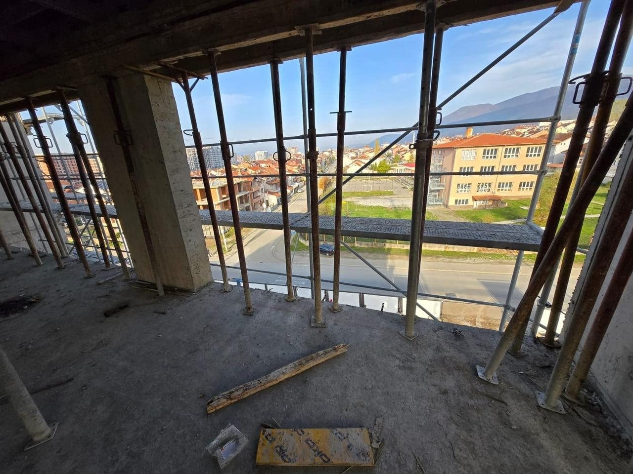 Elysium Series 1 on site: view out from an upper floor slab, framed by props and columns.